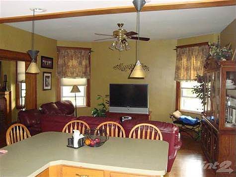 Informal Eating Island between Open Area Family Room and Kitchen.  Allows convient conversation and entertainment with Family and Friends.