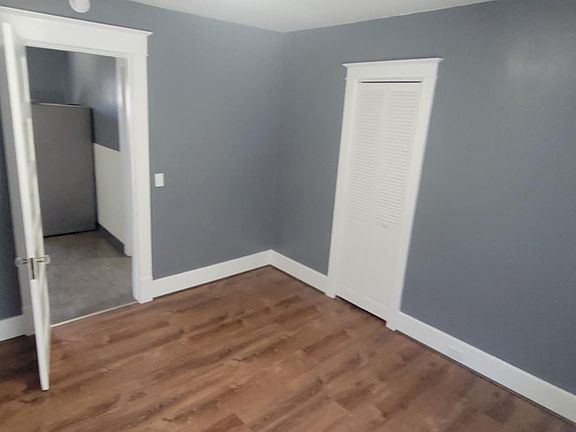 1st bedroom (12x11) facing kitchen with closet door