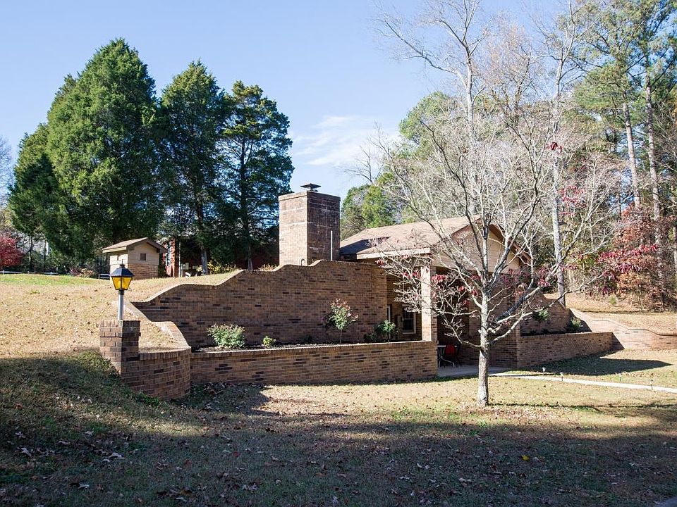Large covered porch with built-in flower beds