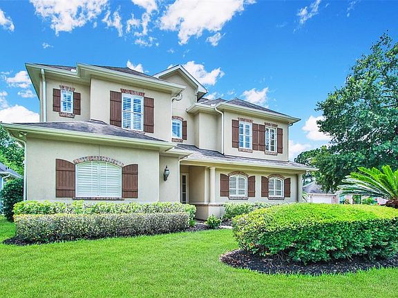 Gorgeous Stucco home with brick and cedar accents.