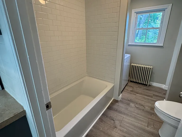 Updated bathroom with washer/dryer and closet