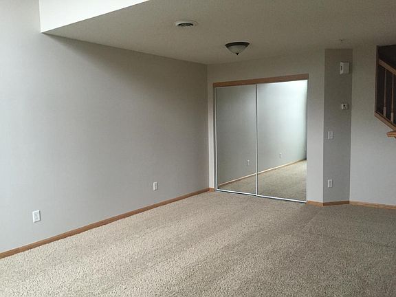 Dining room with storage closet and loft above.