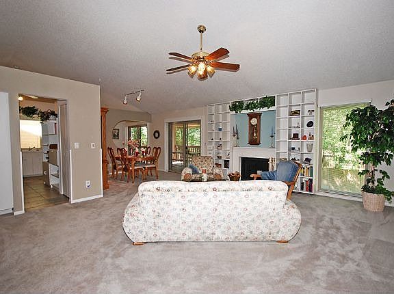 Large great room has cozy fireplace