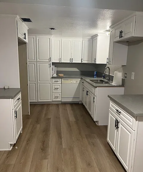 Kitchen with grey quartz counter tops