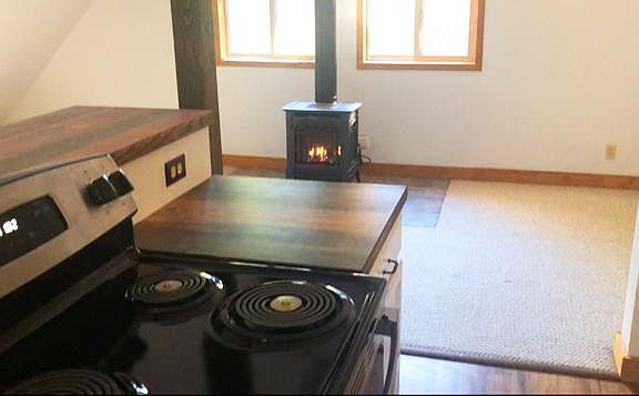 Propane free standing heater/fireplace and stove/counter.