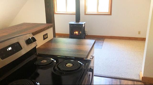 Propane free standing heater/fireplace and stove/counter.