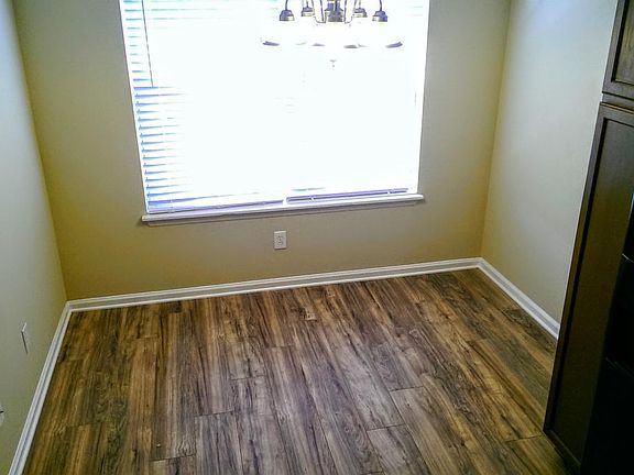 Large farmhouse style dining area with room for a 6 person t