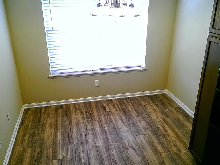 Large farmhouse style dining area with room for a 6 person t