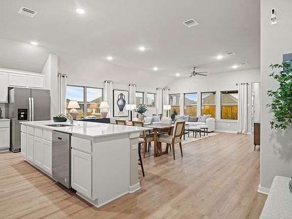 Kitchen in the Diamond home plan by Trophy Signature Homes - REPRESENTATIVE PHOTO