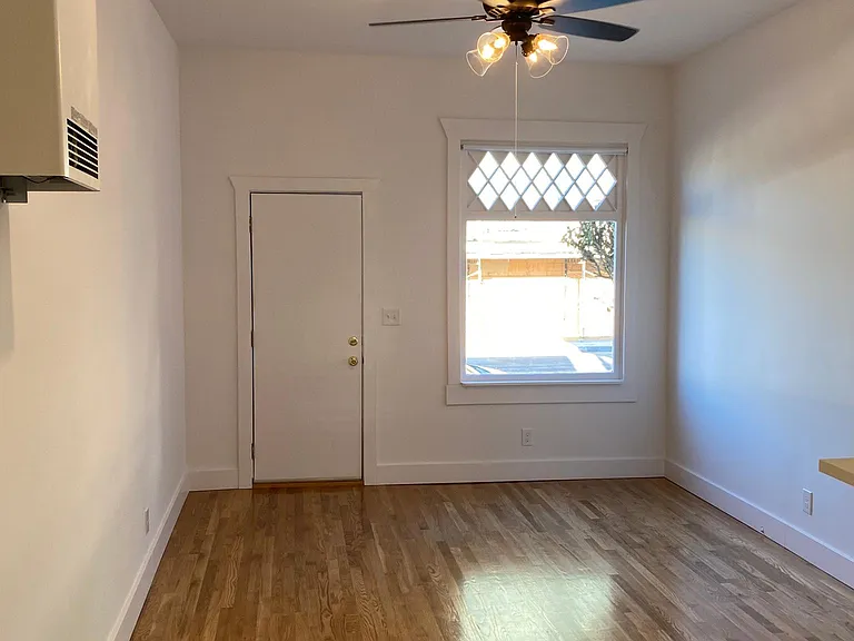 KITCHEN OPENS INTO LIVING ROOM AND COZY DINING AREA