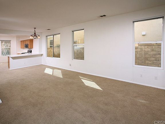 The expansive living/family room is bathed in natu