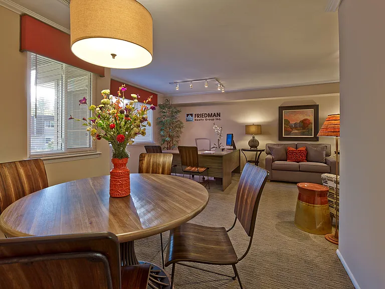 Bright and welcoming leasing office at Haynes Run Apartments with stylish seating and floral touches in Medford, NJ.