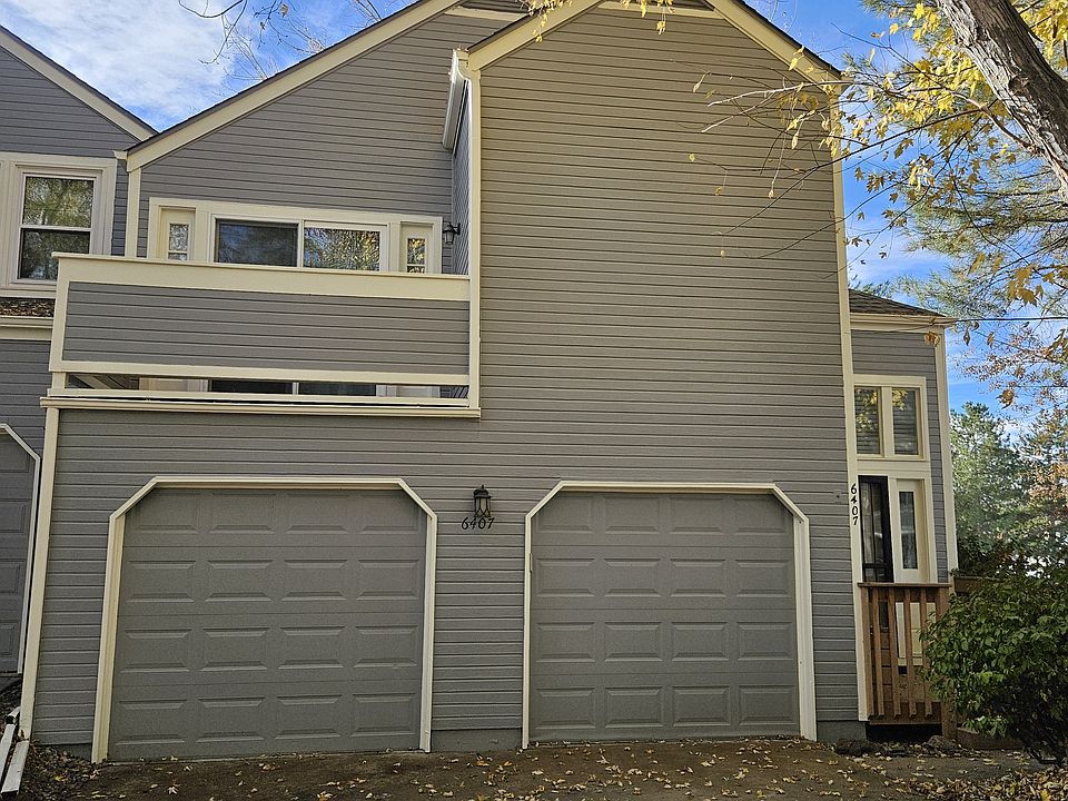 Front of home with attached two car garage.