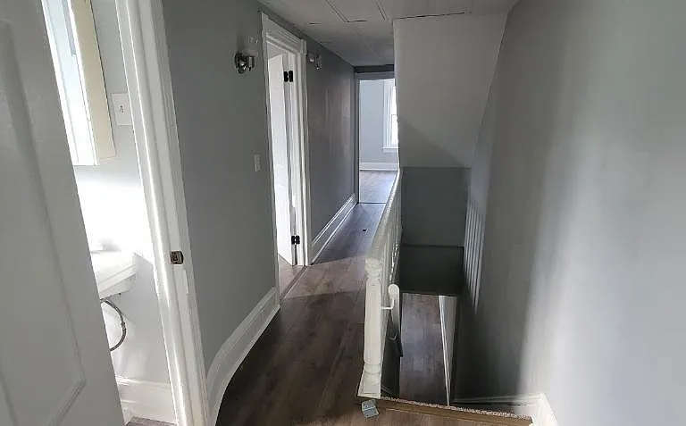 2nd floor hallway. Entrance to bathroom Bedroom #2 and view of Master bedroom in the distance