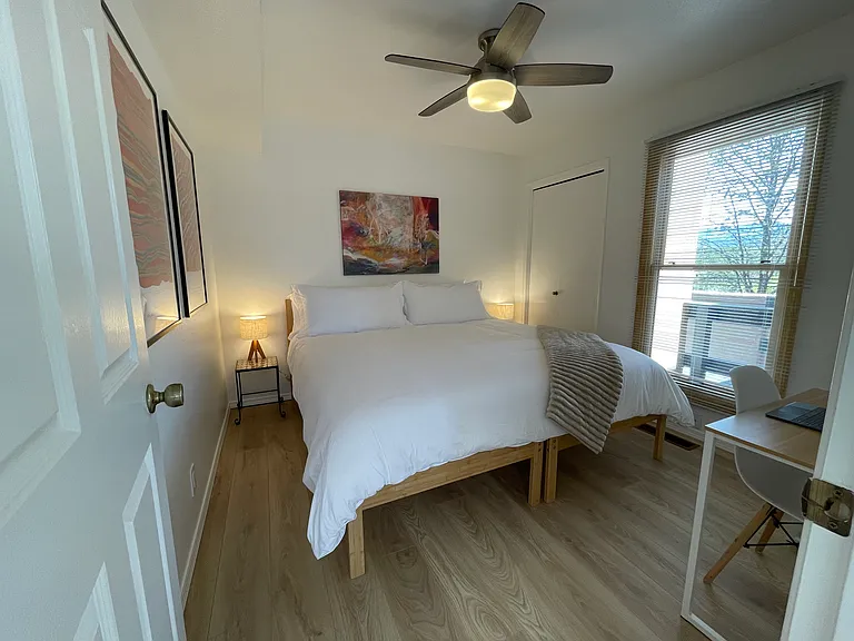 Upstairs Bedroom in king bed configuration and dedicated workspace