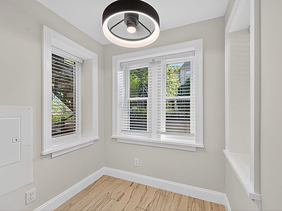 Table space kitchen with bay window and LED light with encased fan