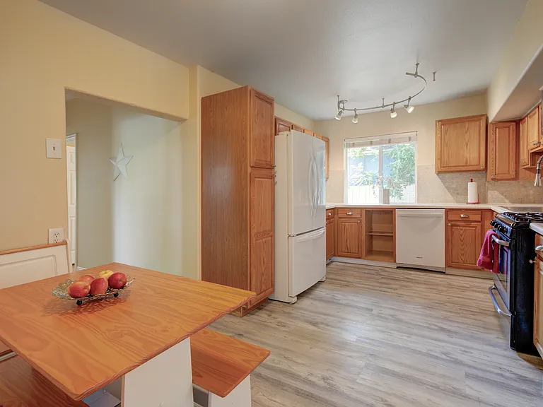 LARGE KITCHEN with gas stove, dishwasher, large refridgerator, overhead microwave, lots counter space and cabinet storage