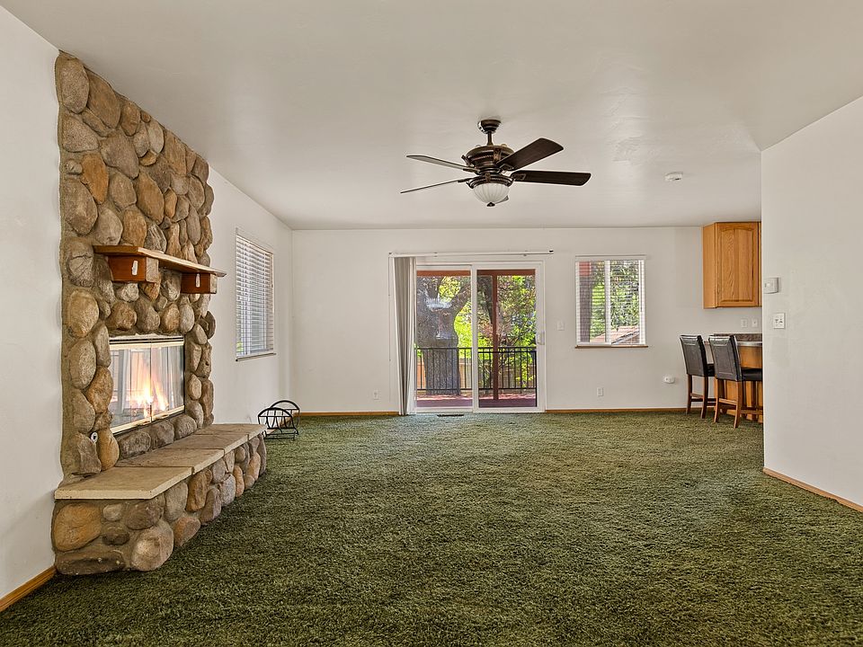 Living room open to dining and kitchen area.