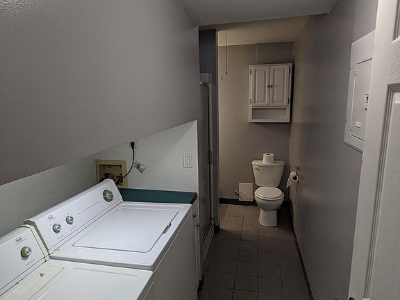 Laundry and second bathroom with shower