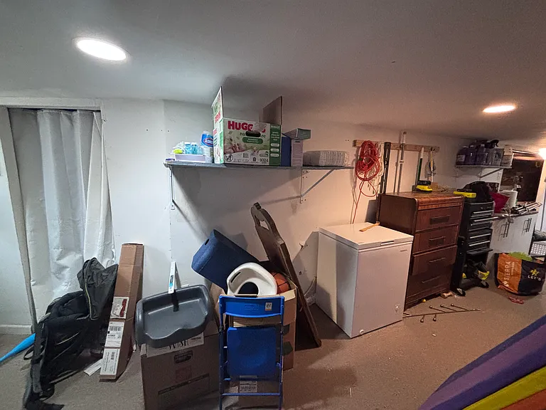 Basement storage area (chest freezer, brown dresser included, optional)