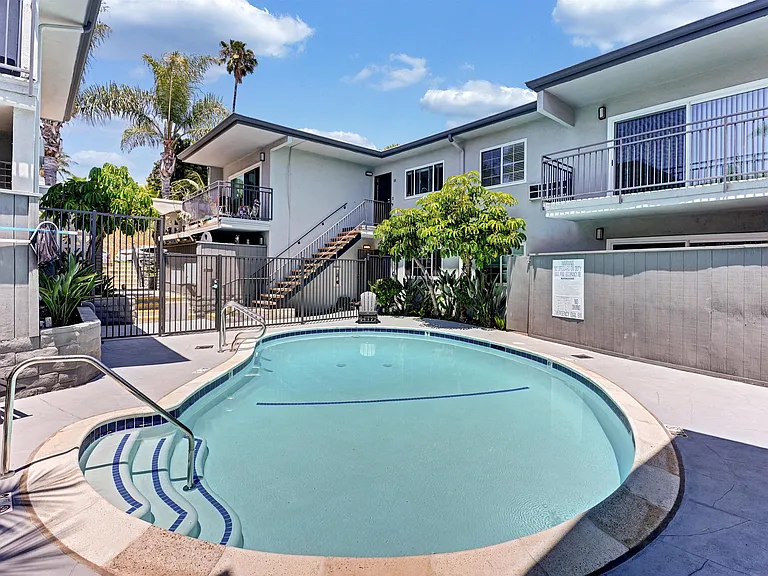 A swimming pool in the center of the apartment complex