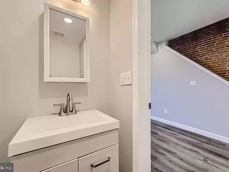 Powder Room / Half Bath (empty view prior to most recent tenant moving in)