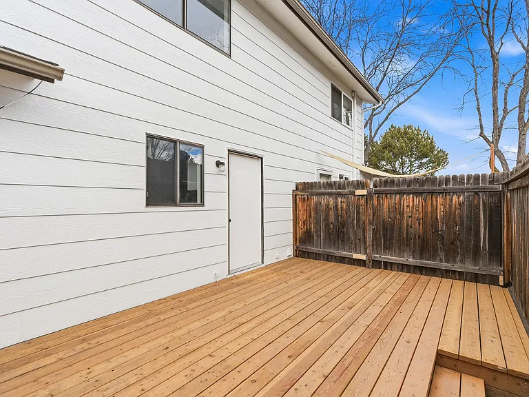 Great enclosed deck for privacy that leads directly to covered carport.