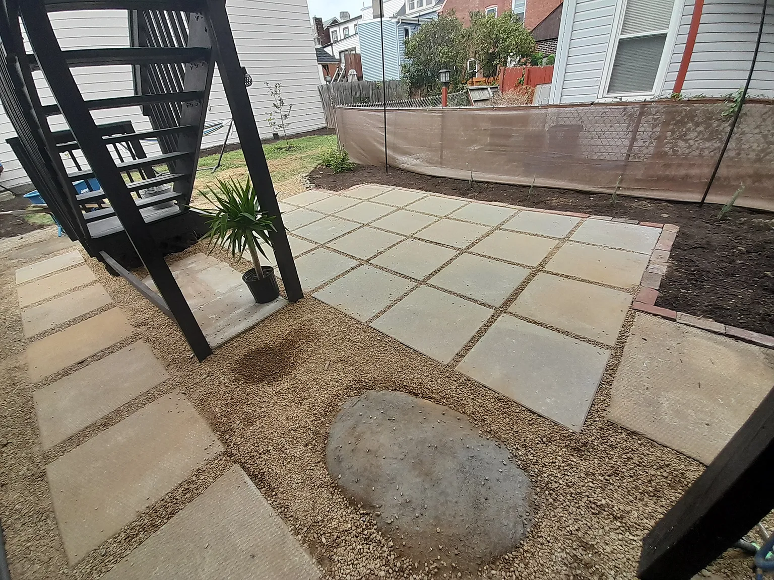 Gorgeous patio install with privacy trees growing in. Bring your patio table and enjoy meals and conversations outdoors.