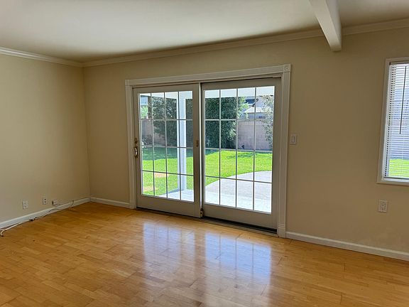 Living room with French doors onto back patio / yard