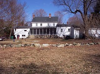 rear, showing screened-in flagstone back porch