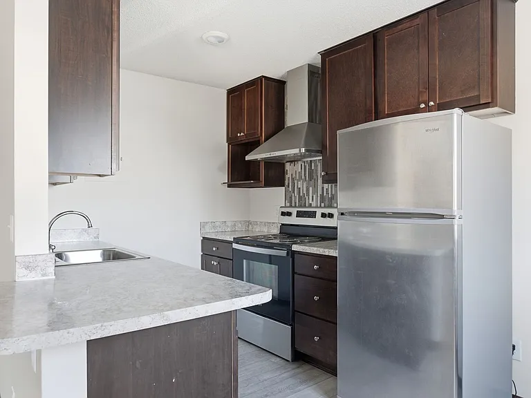 Elevate your living at St. Anthony Group, where modern kitchens meet sleek design. Enjoy stylish appliances, ample counter space, and the perfect layout for cooking and entertaining. Don't miss out on your dream homeschedule a tour today!