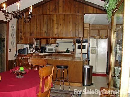 Dining Room & kitchen : Catheral Ceiling; gas stove,oven. bar separates kitchen and dining room.