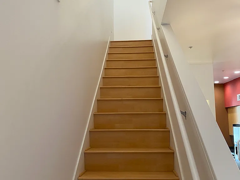 Two staircases in unit. This one leads to Bedroom
