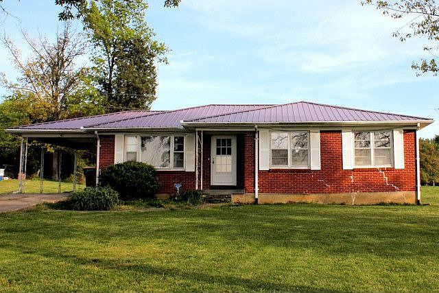 Brick Home and 16 +/- Acre Mini farm at Absolute Auction.