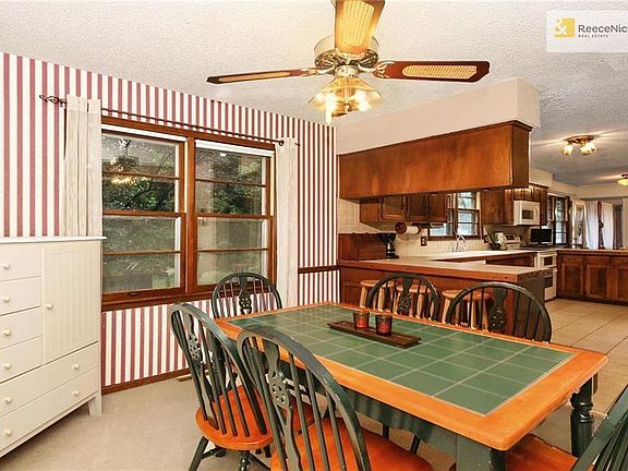 There is also a formal dining room with convenient serving bar.