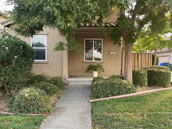 Front of the house: Current photo. Tree and plants have grown in providing privacy. Front yard is maintained by HOA along with all your neighbors front yards to keep the community looking nice and consistent.
