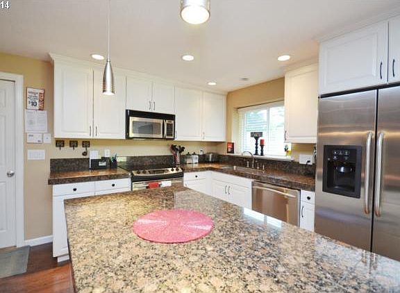 Granite counters and stainless steel, lots of cabinet space