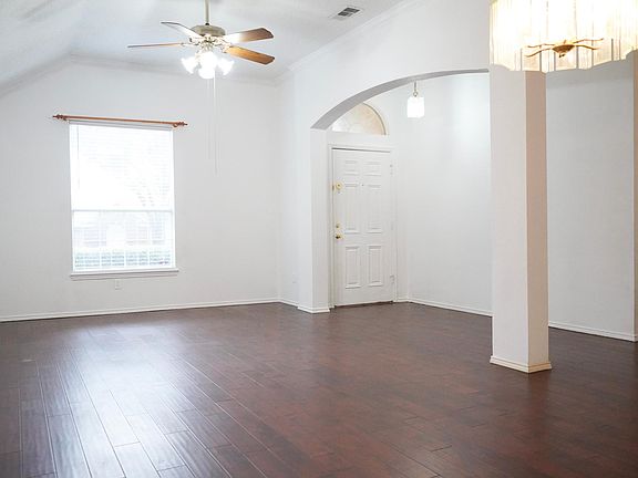 Entrance leads to a Formal Living and Dining area to the Right. Hardwood floors throughout.