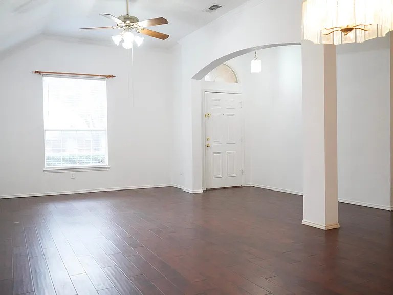Entrance leads to a Formal Living and Dining area to the Right. Hardwood floors throughout.