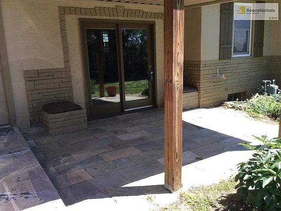 Covered tiled patio off family room - perfect for summer bar-b- q's.