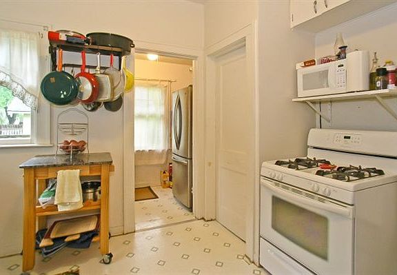 Kitchen, Mud Room, and Door to Basement (now refinished hard