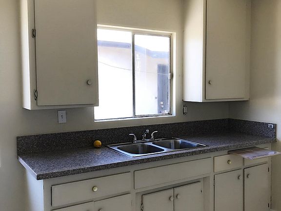 Kitchen with aluminum window OLD cabinet knobs
