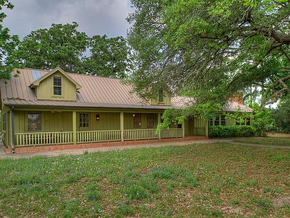 Mature live oak trees loom over this original 1900's farm house. Extensive additions & remodeling in 1969 & 1986 brought it to it's current grandeur.
