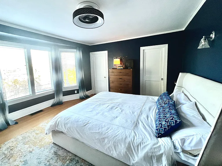 Master Bedroom and doors to ensuite bathroom and walk in closet