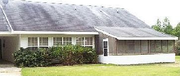 Back of Home
						:
						Shows windows again and the screeened-in porch