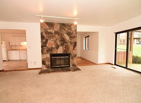 Ceiling to floor stone fireplace accents large living room.  Great open floor plan.