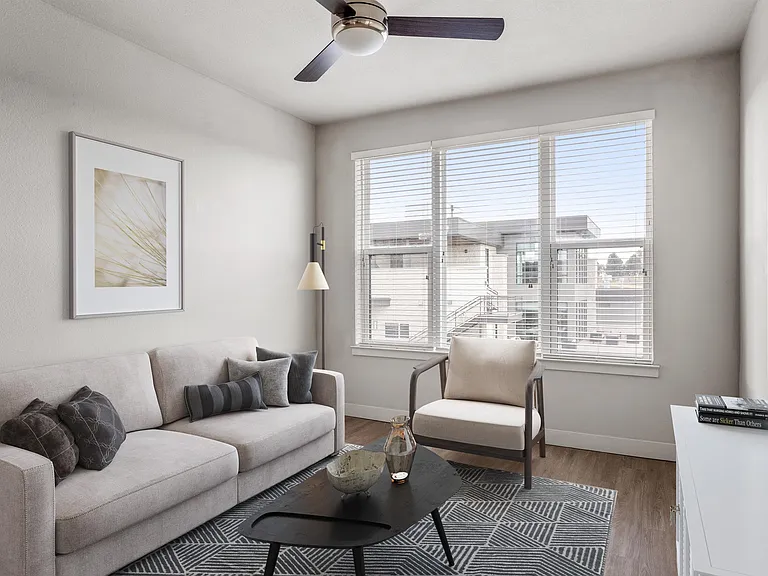 Modern Living Room with Ceiling Fan and Large Windows