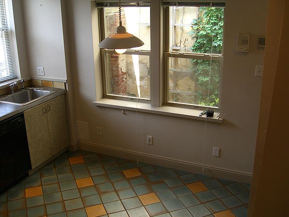 Dining/ Kitchen looking to Entry/ Garden- updated quartz countertops