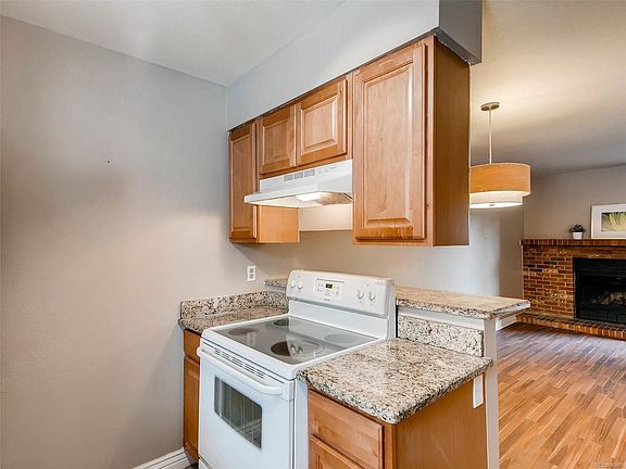 Breakfast bar with updated lighting in dining area.