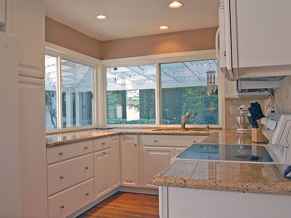 A corner of windows for a light, bright kitchen.